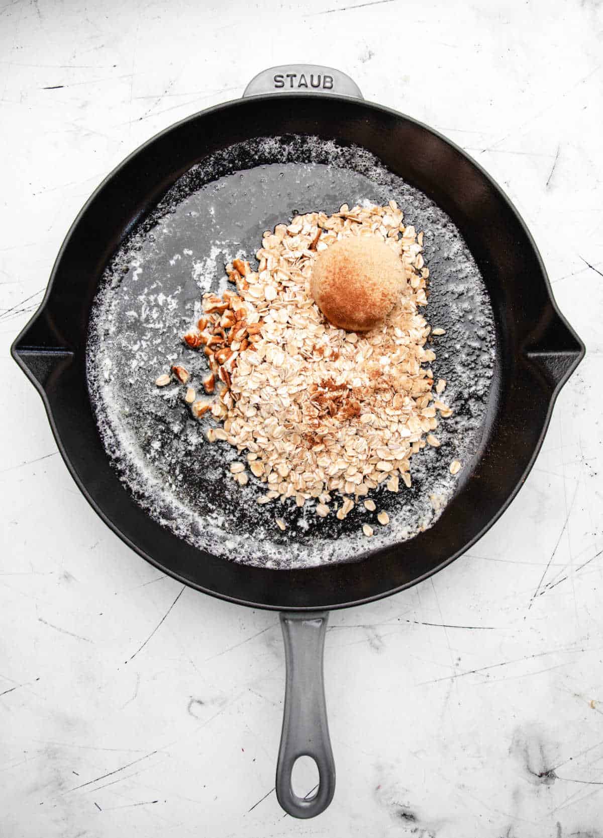 Brown sugar oats and cinnamon in melted butter.