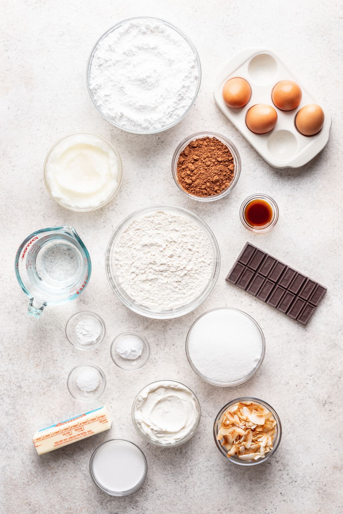 Ingredients for chocolate coconut cake in dishes.