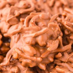 Close up photo of no bake chow mein noodle cookies on a white plate.