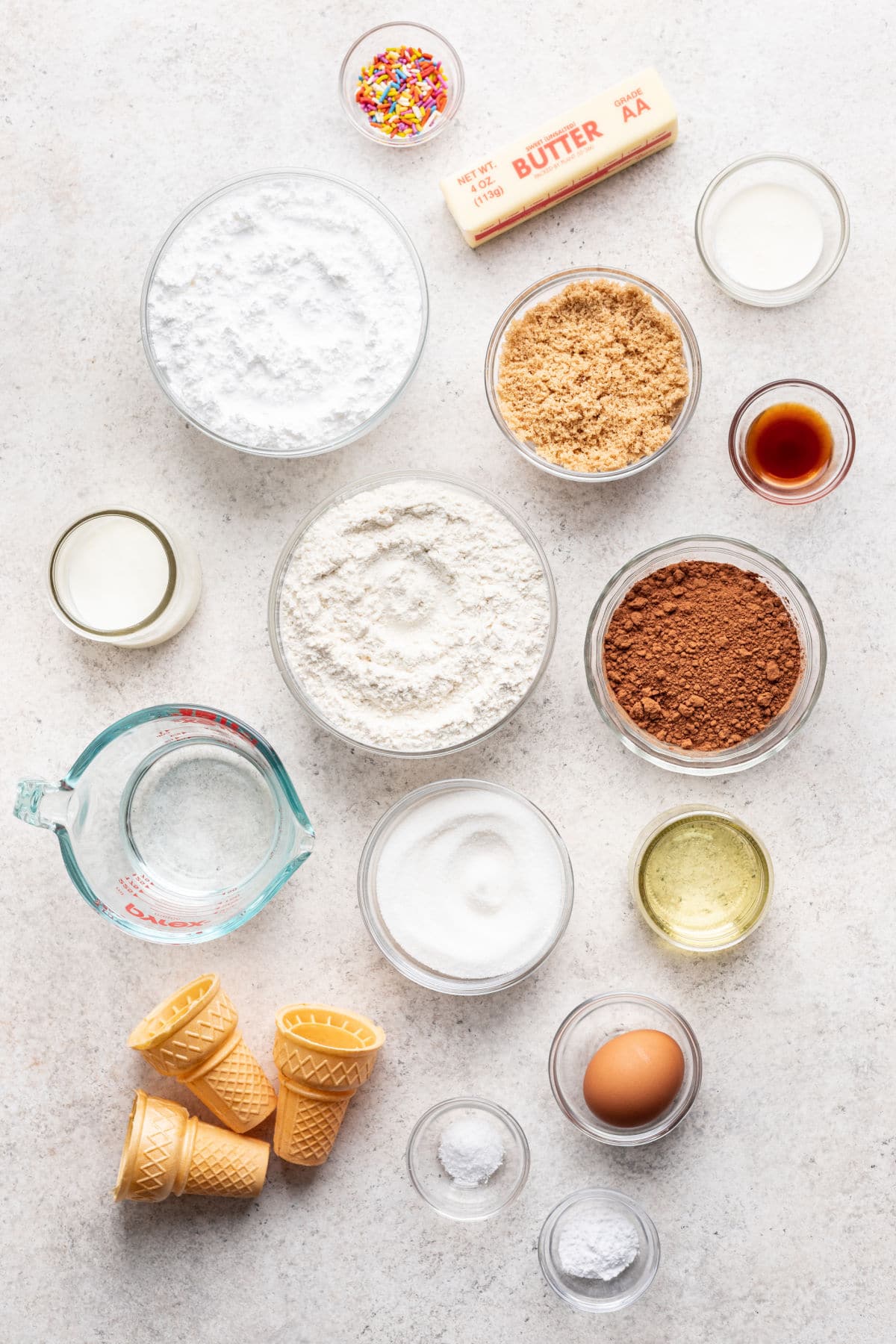 Ingredients for ice cream cone cupcakes in dishes.