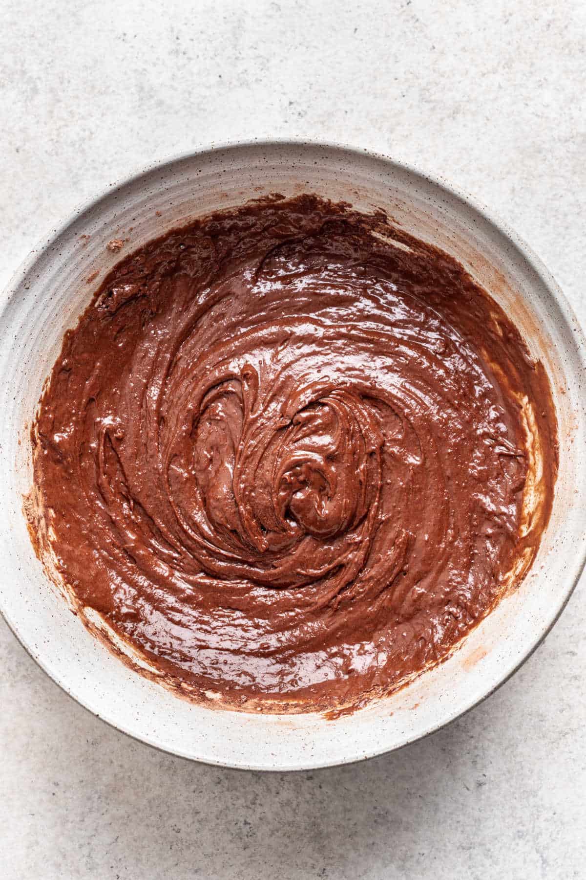 Ice cream cone cupcake batter in a white mixing bowl.