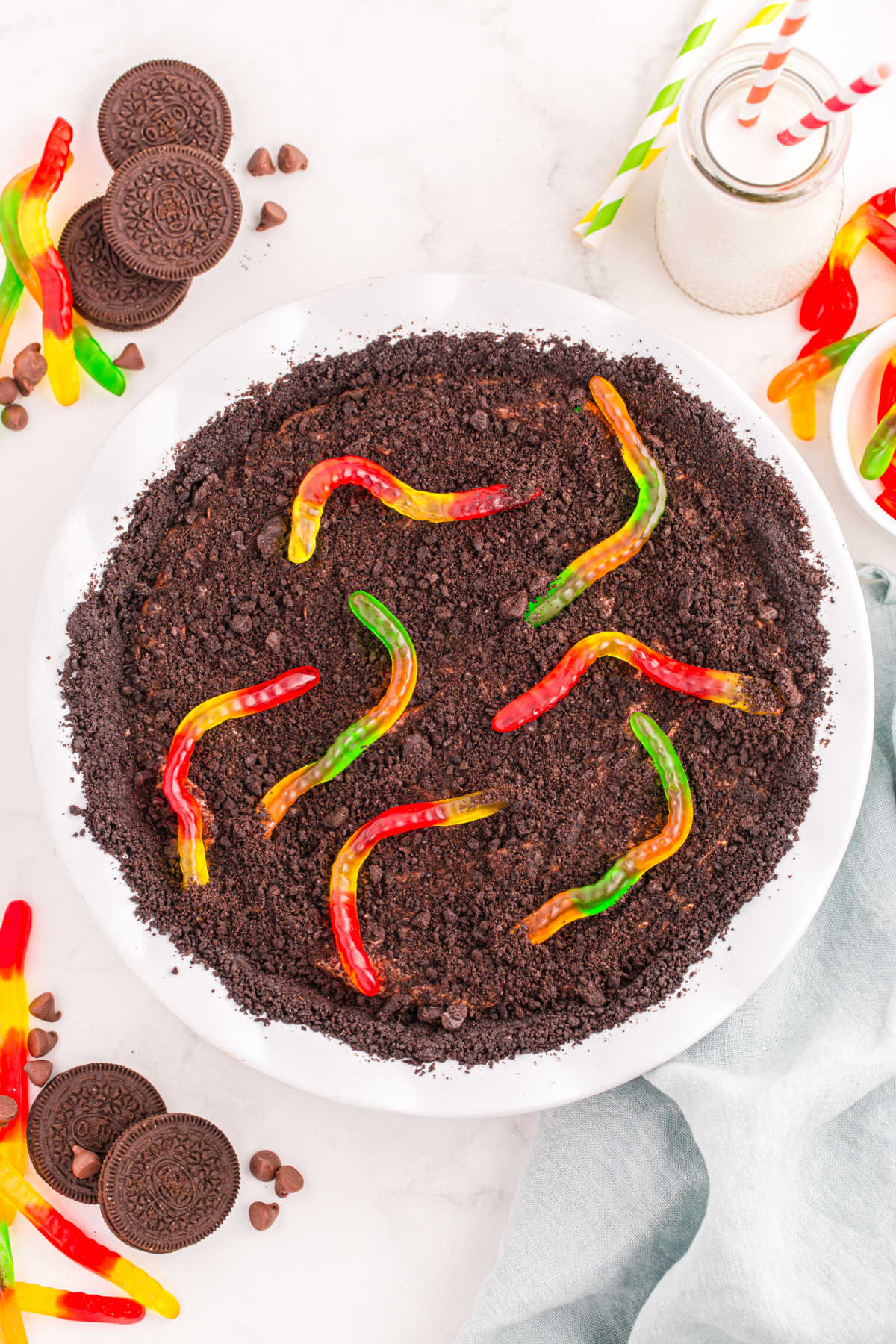 Oreo dirt pie topped with cookie crumbs and gummy worms.