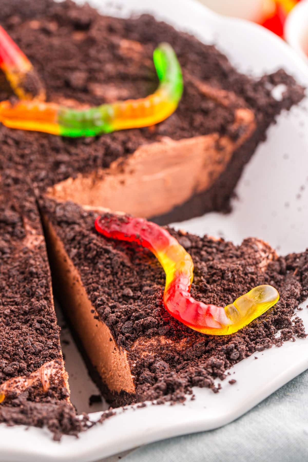A cut slice in an Oreo dirt pie.