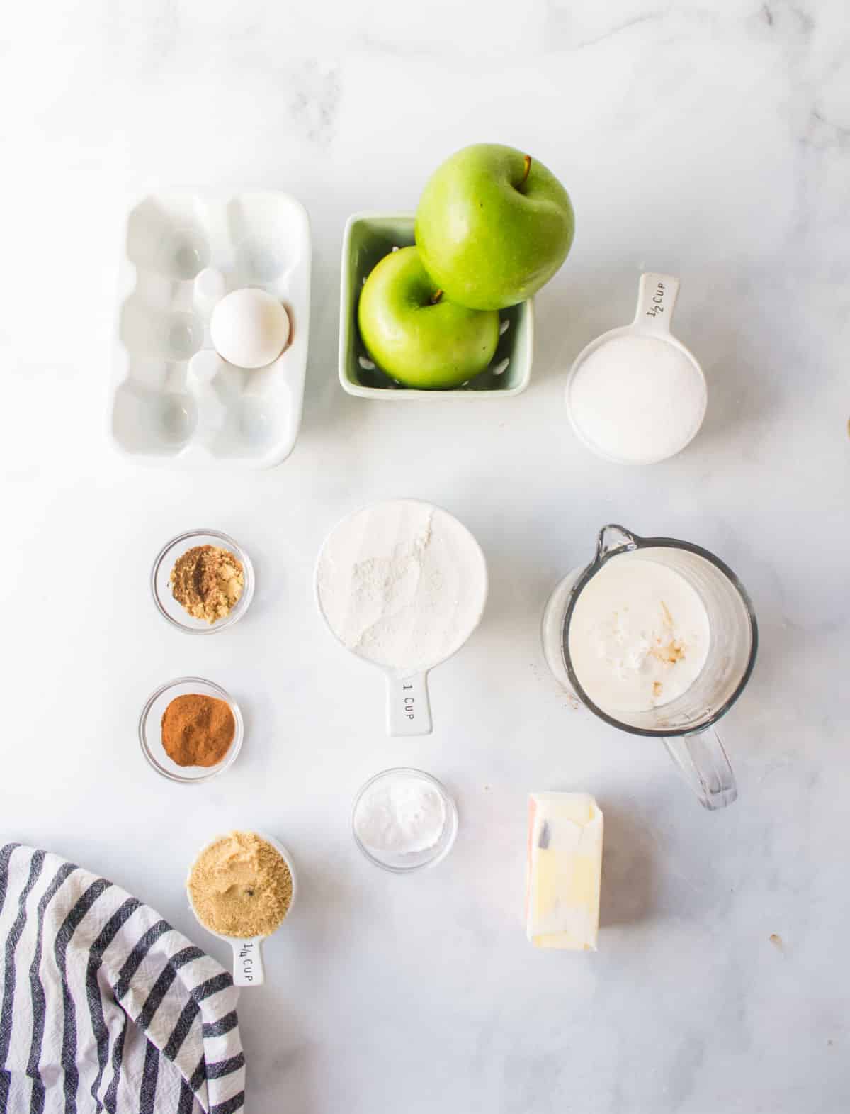 Ingredients for apple muffins in dishes.