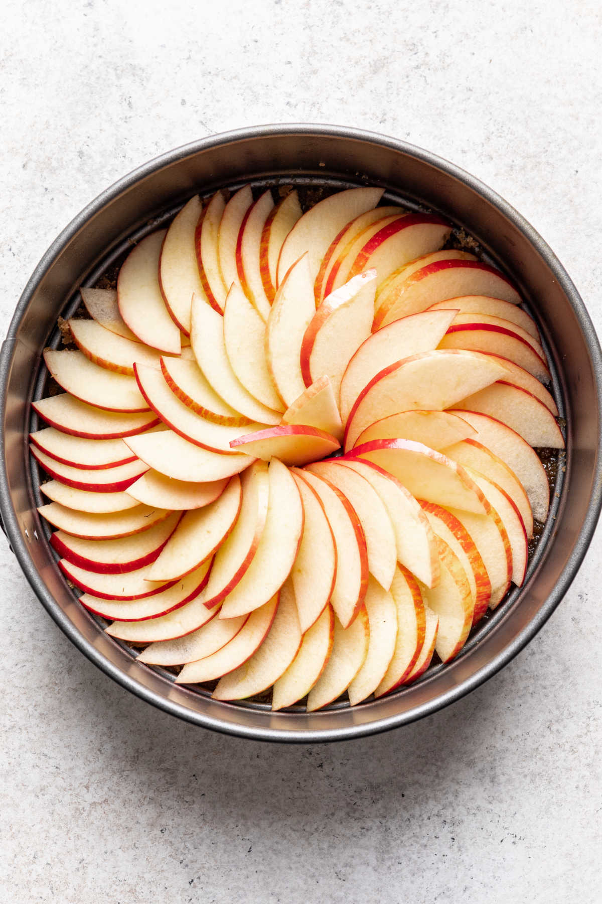 Apple slices in a concentric circle in a ring.