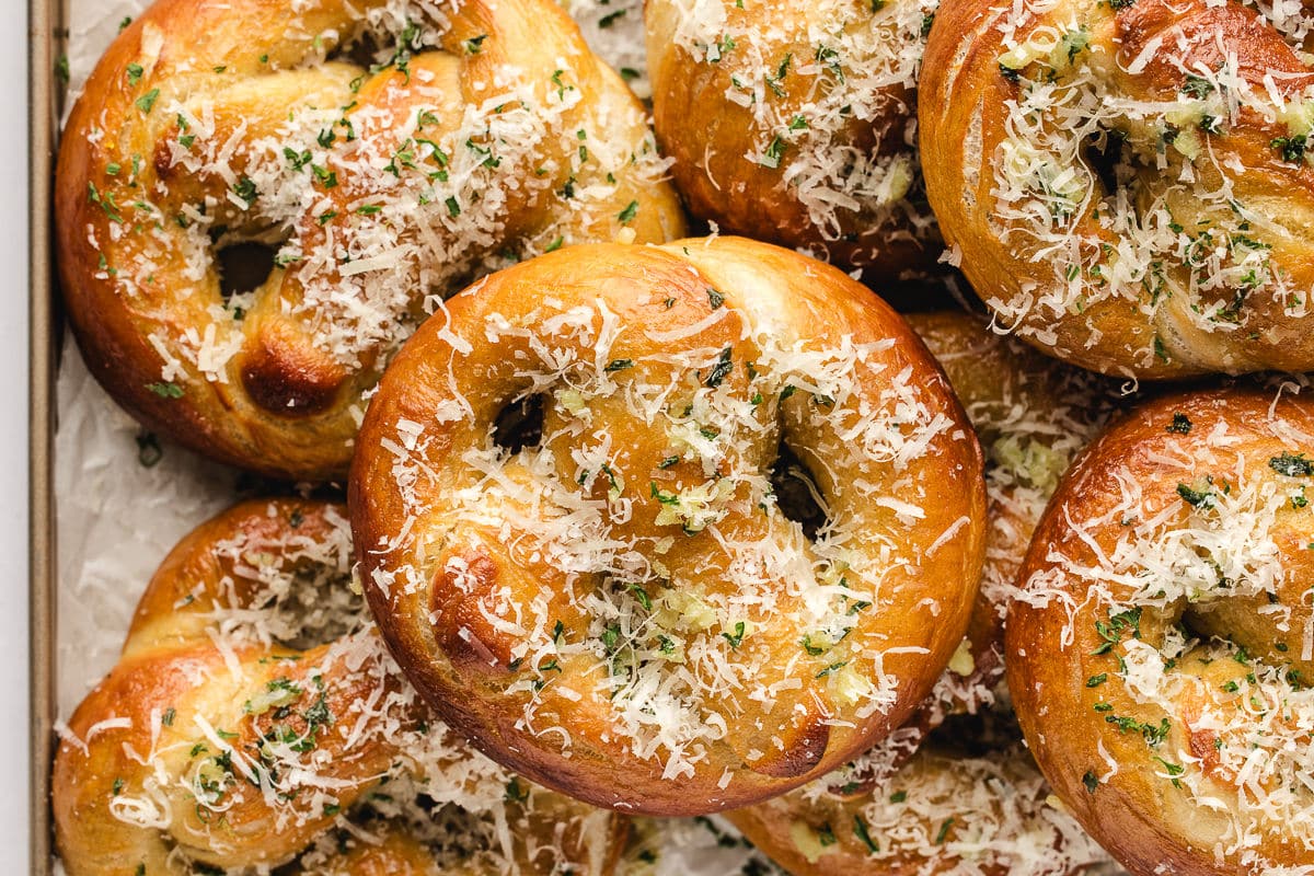 Garlic parmesan pretzels on a baking tray.