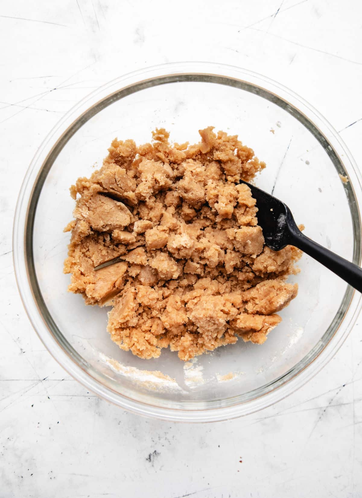 Crumble topping in a glass mixing bowl.