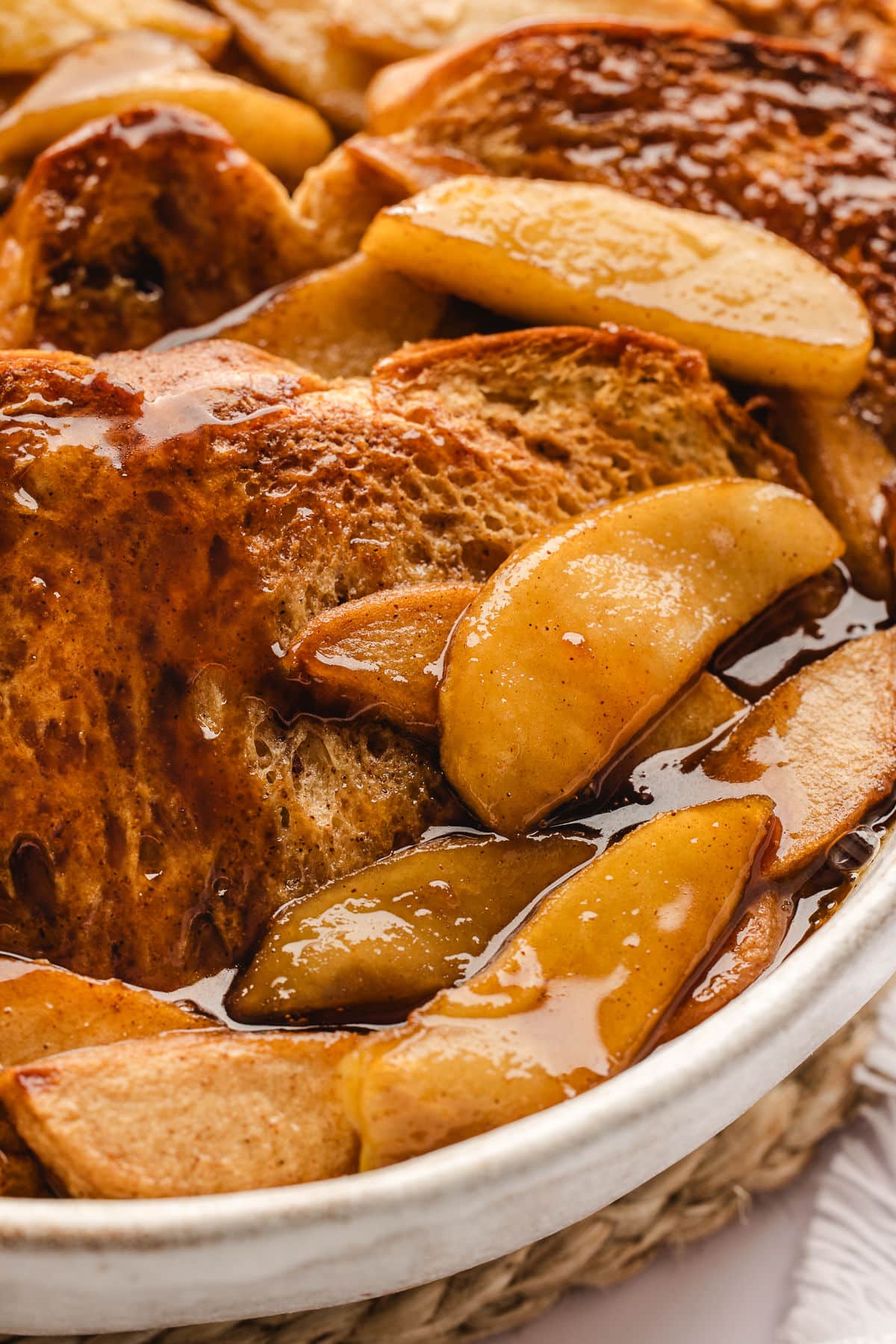 Baked apple baked French toast in an oval baker.