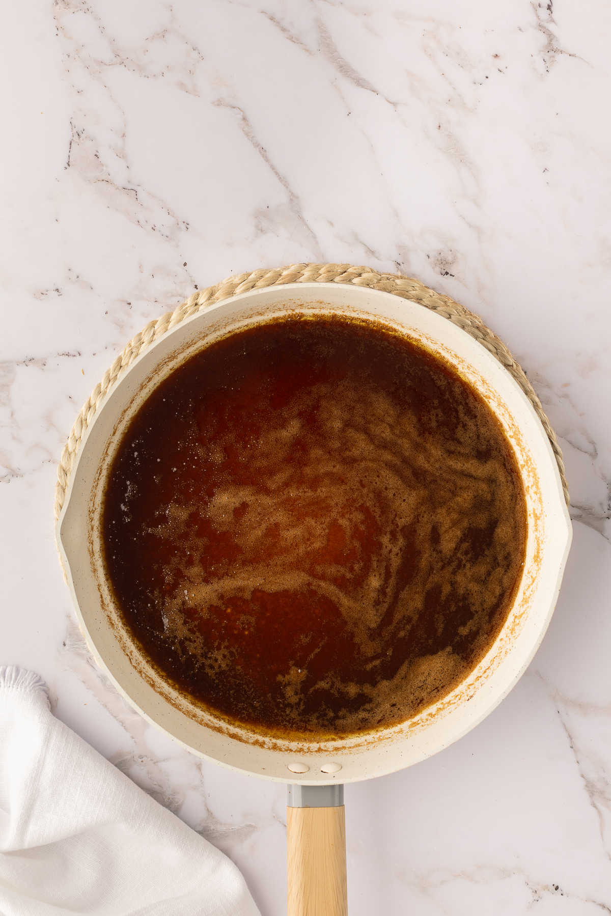 Apple cider butter mixture in a saucepan.