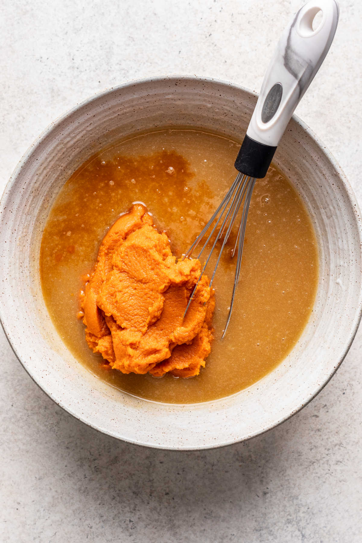 Pumpkin puree and vanilla extract in egg and sugar mixture.