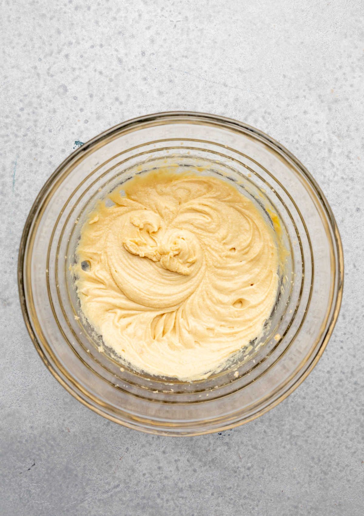 Eggs beaten into creamed butter and sugar mixture.