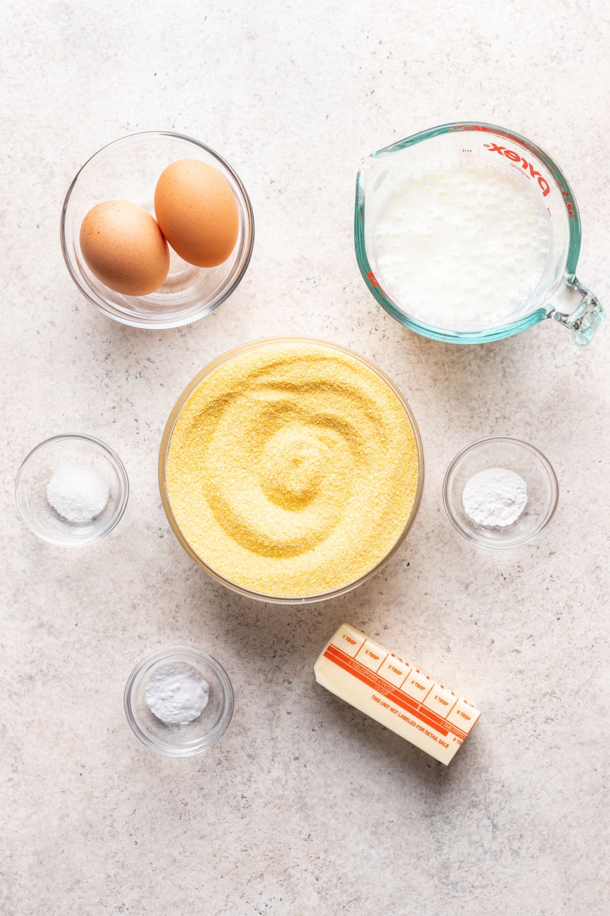 Ingredients for homemade cornbread in dishes.