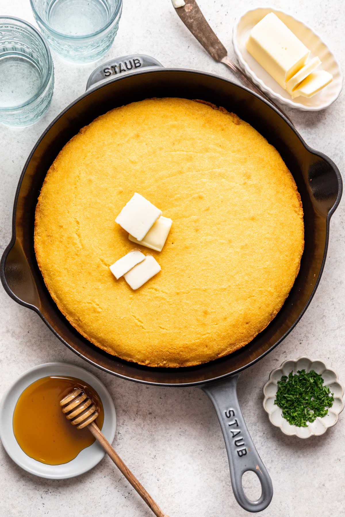 Baked cornbread in a cast iron skillet.