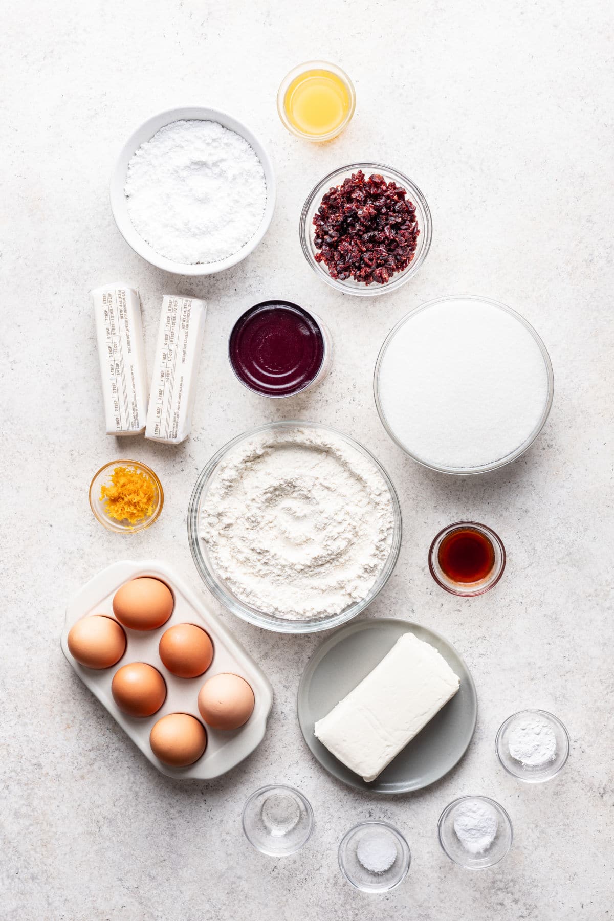 Ingredients for cranberry orange pound cake in dishes.