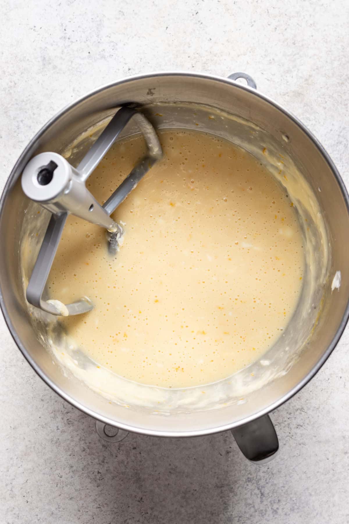 Wet ingredients mixed into creamed butter mixture.