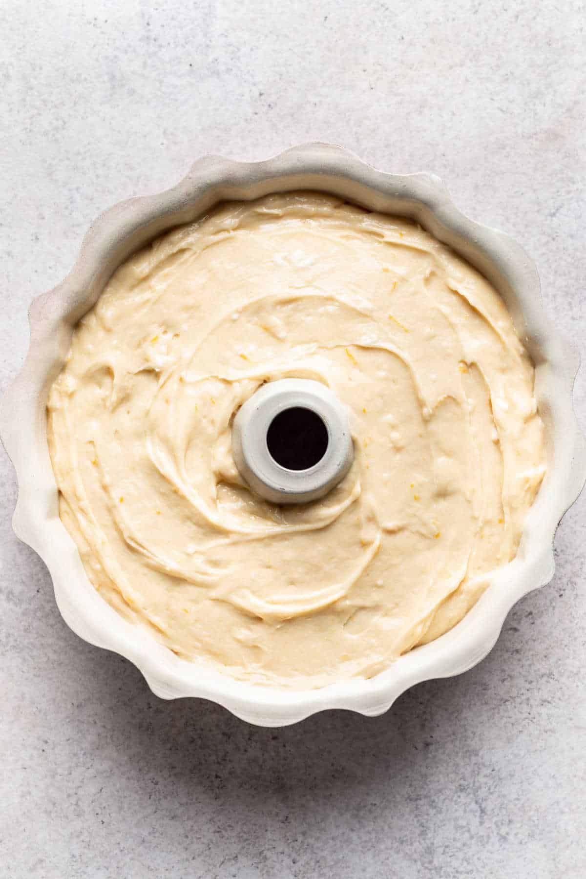 Unbaked cranberry orange pound cake in a bundt pan.