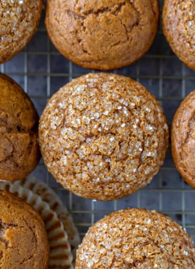 Rows of gingerbread muffins on wire cooling rack.