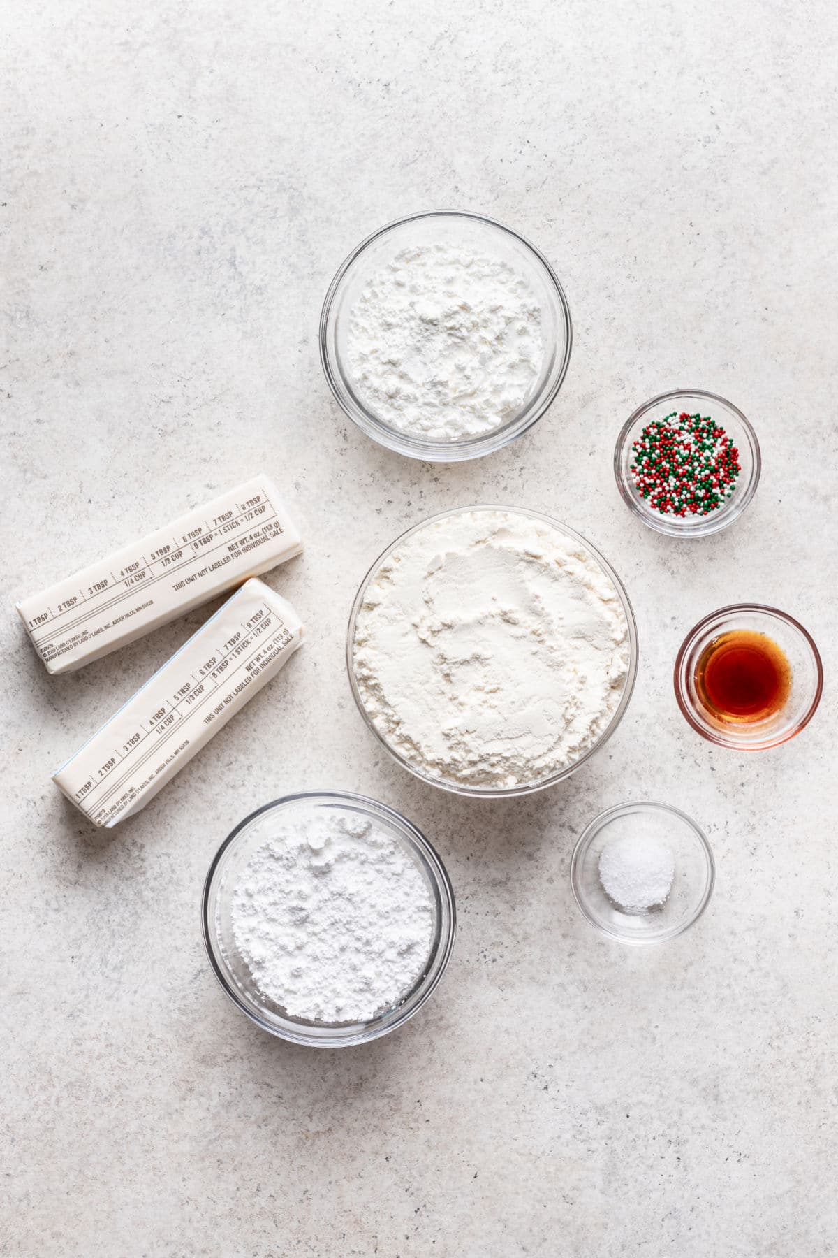 Ingredients for whipped shortbread cookies in dishes.