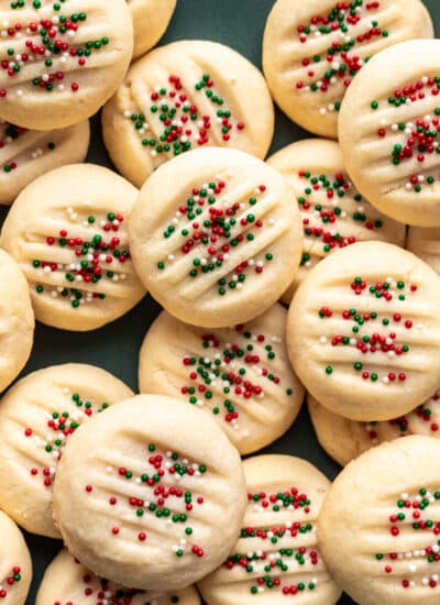 Whipped shortbread cookies topped with nonpareils.