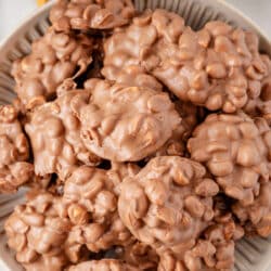 Crock pot candy stacked on a gray plate.