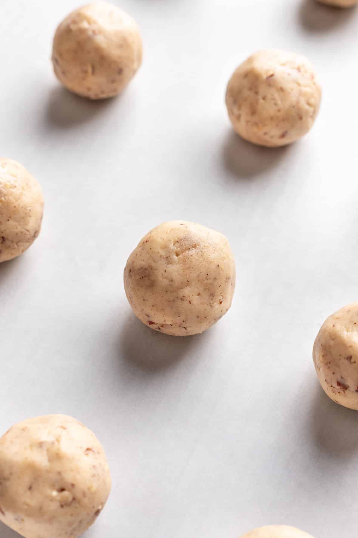 Mexican wedding cookie dough rolled into a ball.