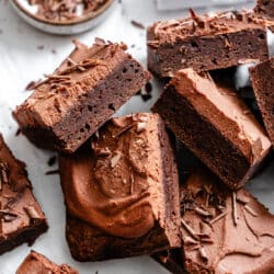 Chocolate mousse brownies in an overlapping stack.