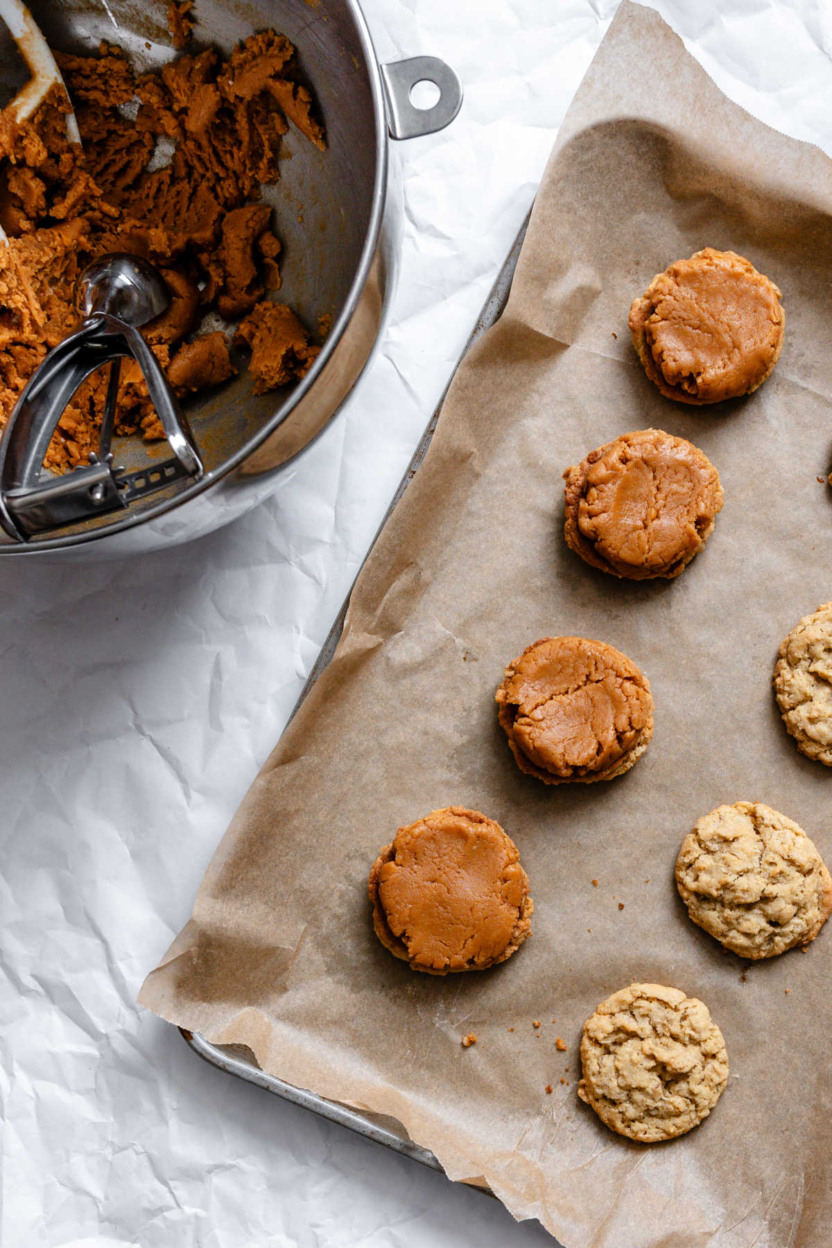 Peanut butter filling spread over baked oatmeal cookies.