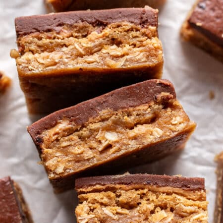 Four peanut butter bars on their side in a row.