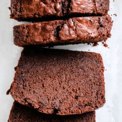 Slices of chocolate pound cake against the cake.