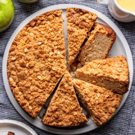 Irish apple cake with slices cut on a platter.