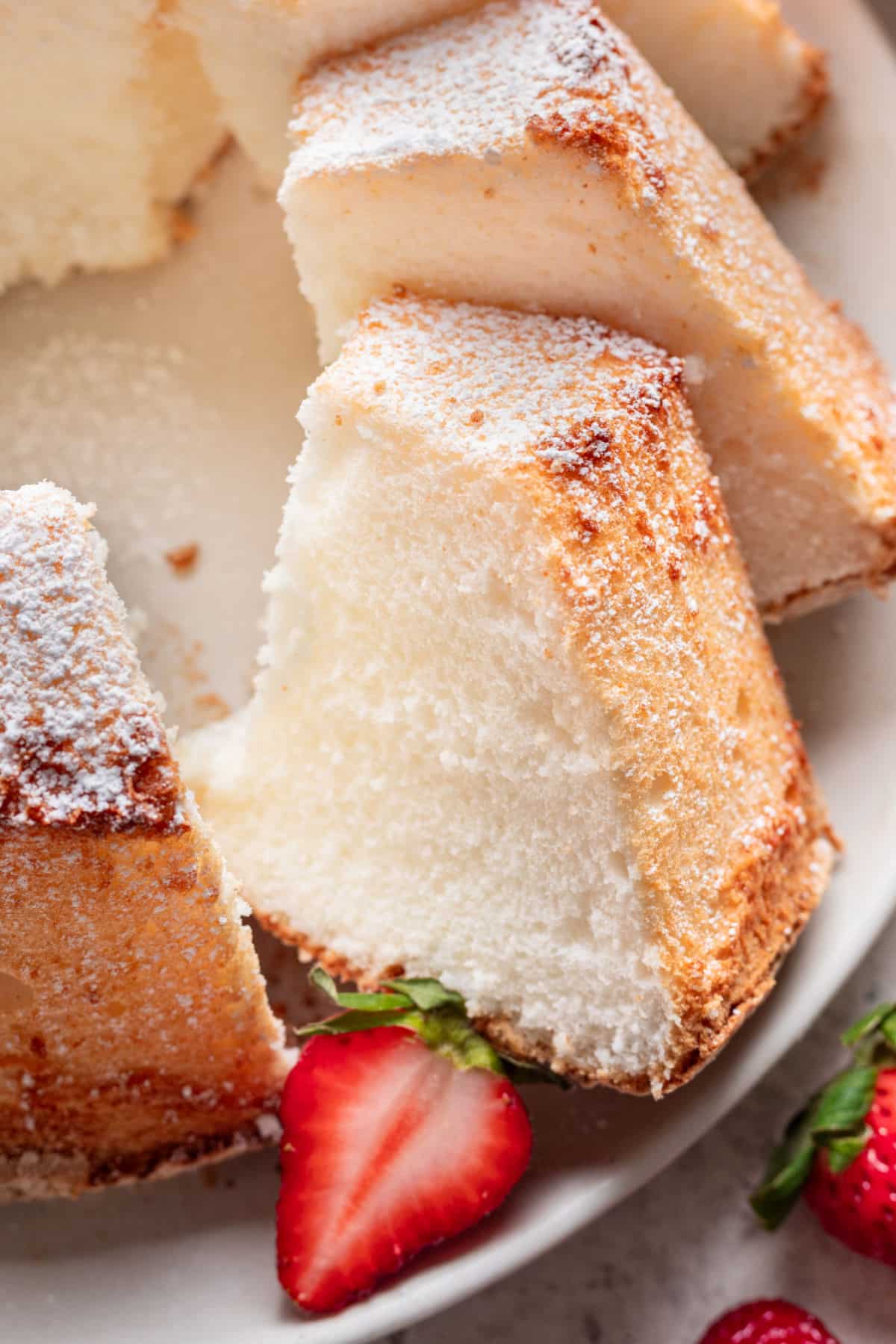 Close up photo of a slice of chiffon cake on a platter.