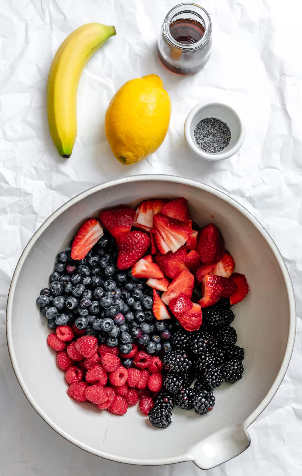 Ingredients for poppy seed fruit salad in dishes.