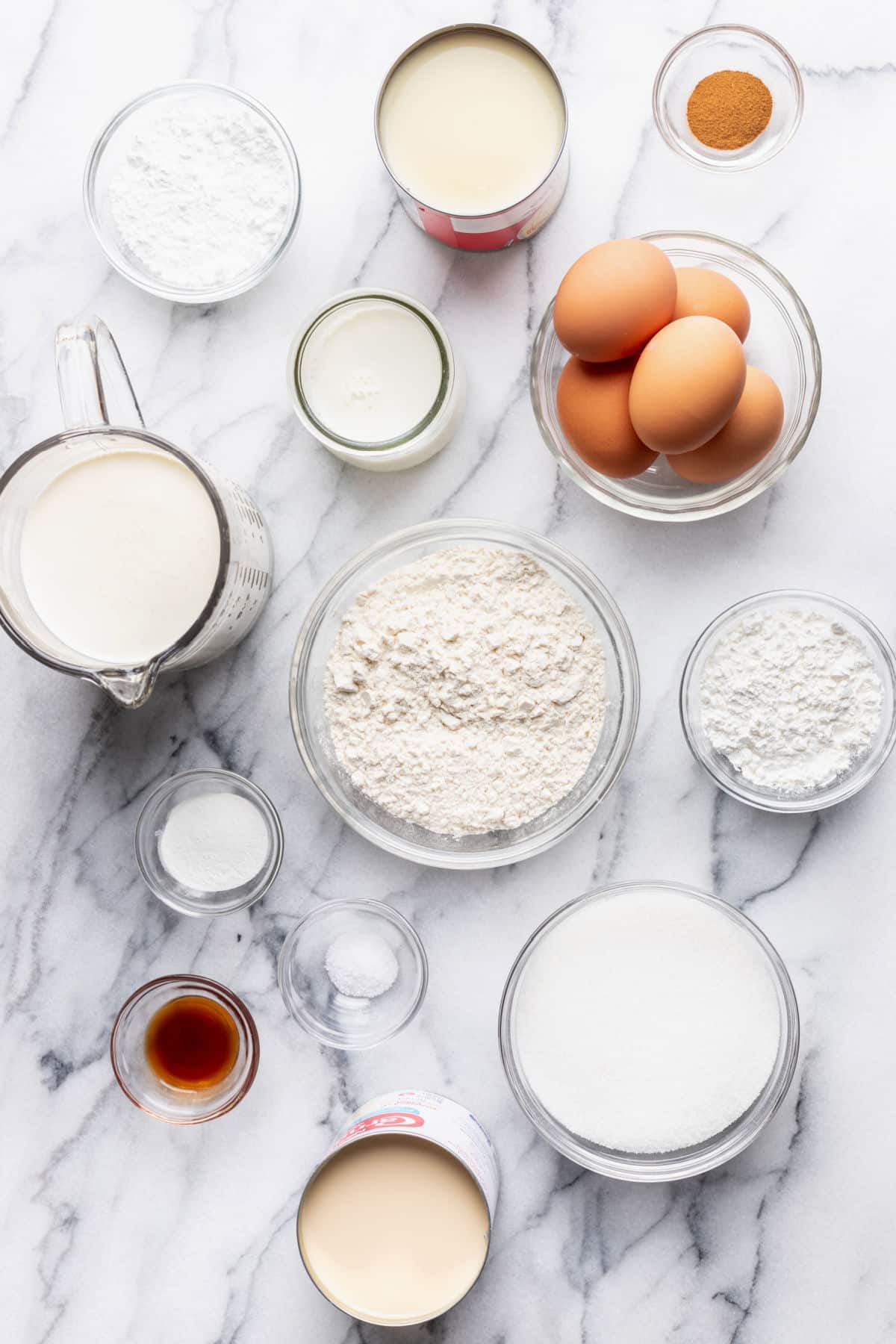 Ingredients for tres leches cake in dishes.