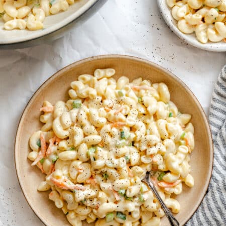 A plate of Hawaiian macaroni salad with a spoon in it.