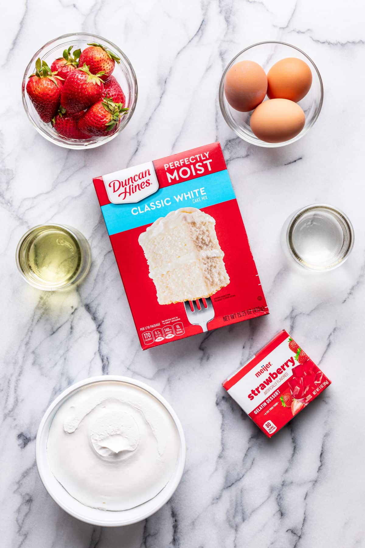 Ingredients for jello poke cake in dishes. 