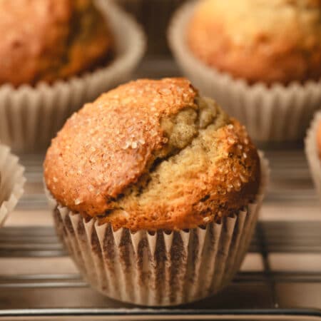 Small batch banana muffins on a wire cooling rack.
