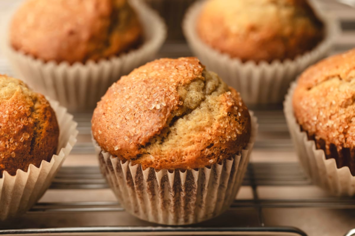 Small batch banana muffins on a wire cooling rack.