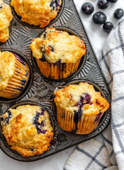 Baked blueberry cottage cheese muffins in a vintage muffin pan.