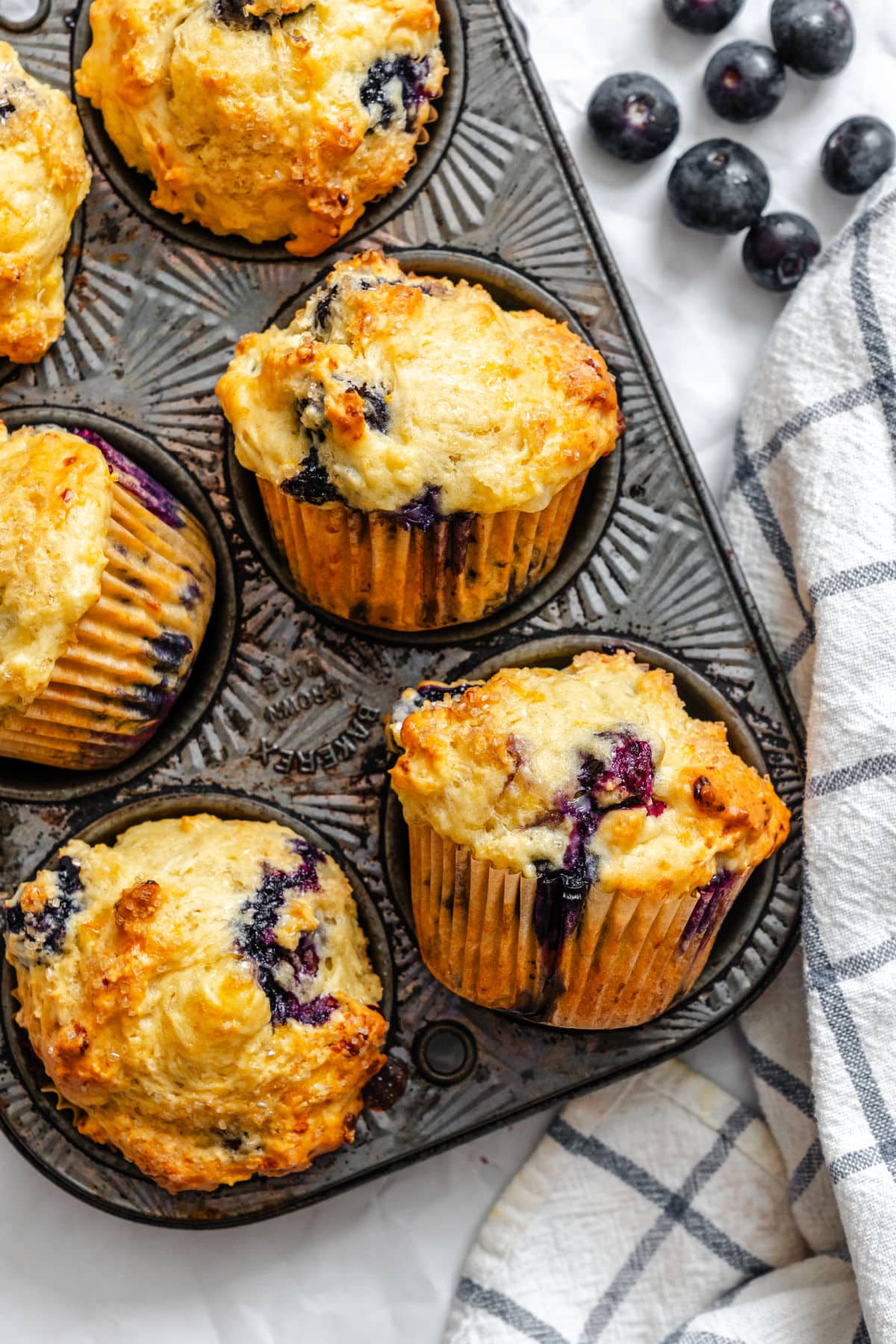 Baked blueberry cottage cheese muffins in a vintage muffin pan.
