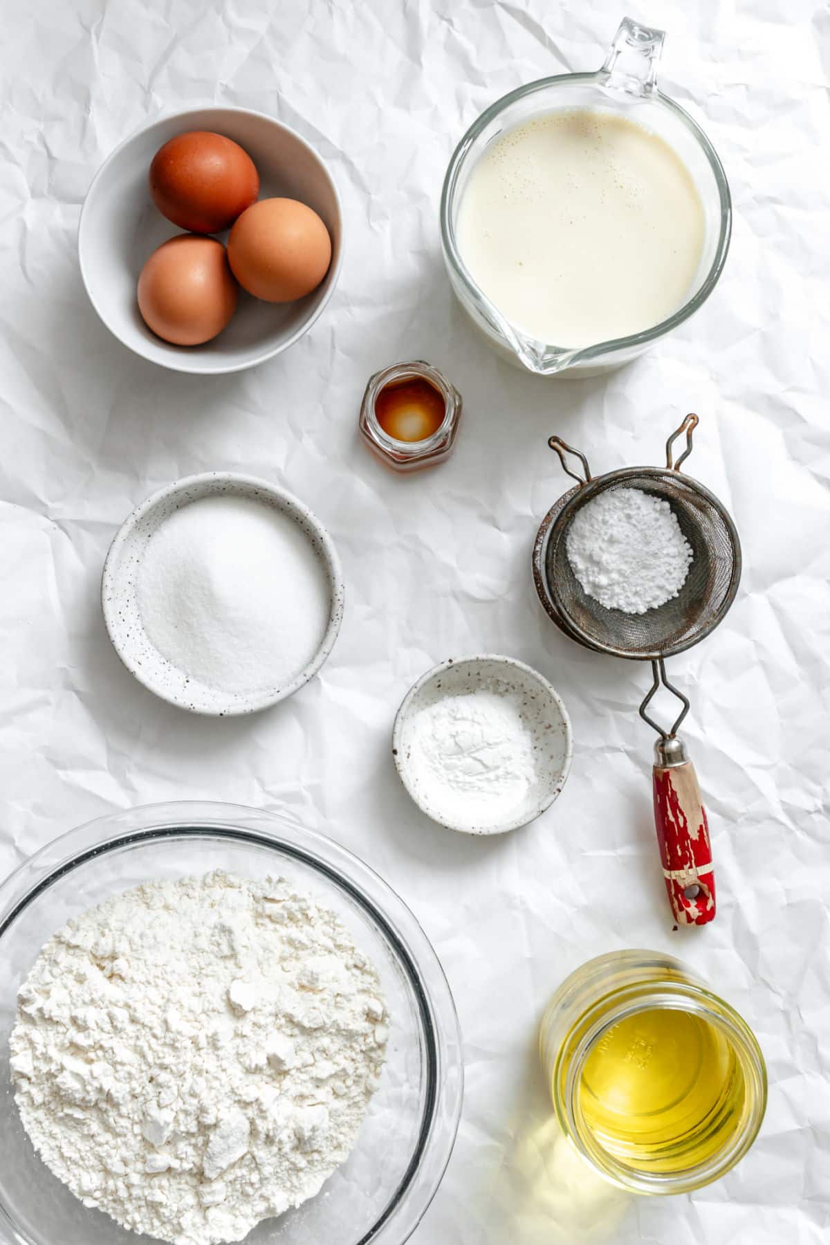 Ingredients for homemade funnel cake in dishes. 