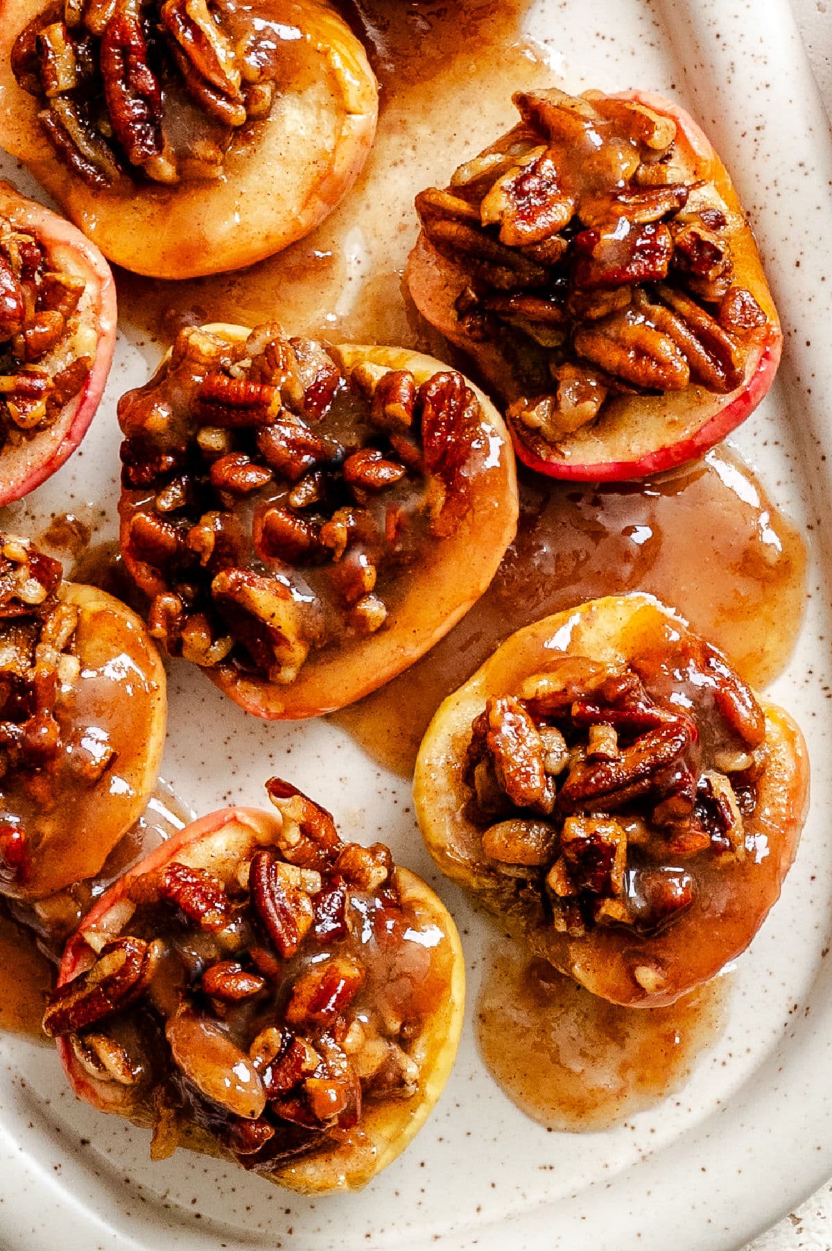 A serving platter with easy baked apples on it.
