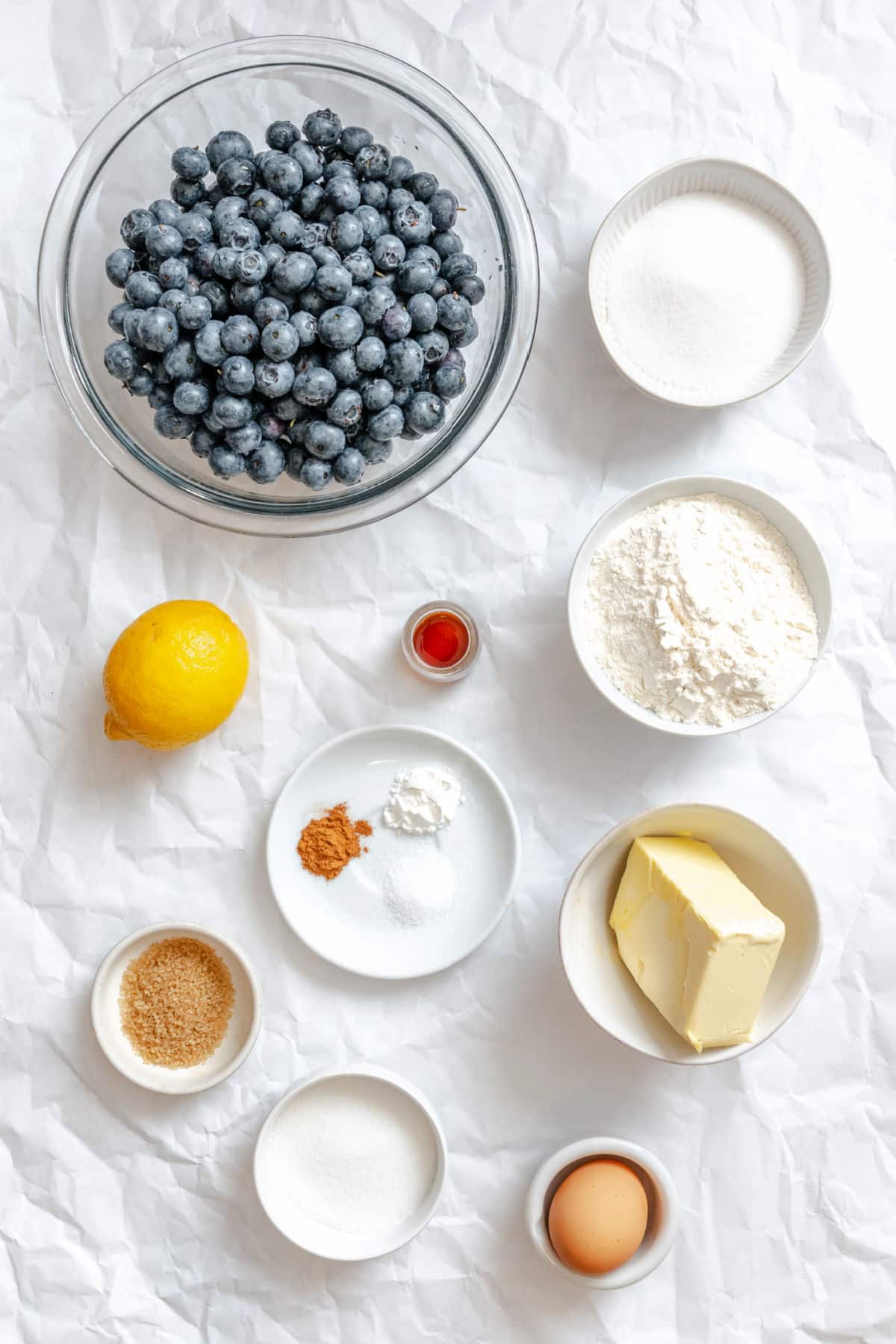 Ingredients for blueberry cobbler in dishes.