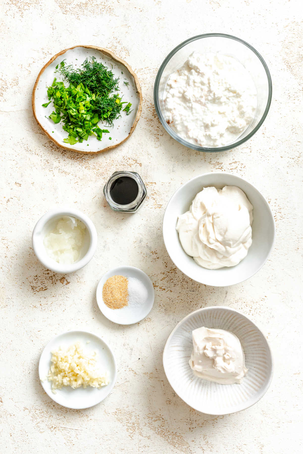 Ingredients for cottage cheese dip in dishes. 