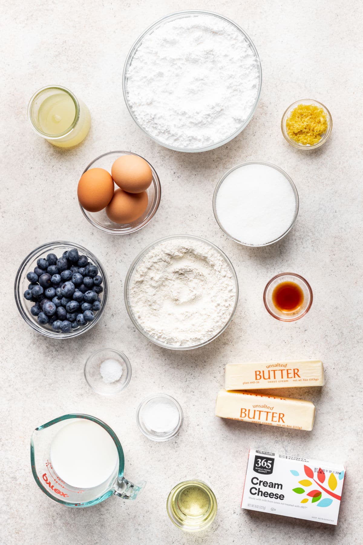 Ingredients for lemon blueberry cake in dishes.
