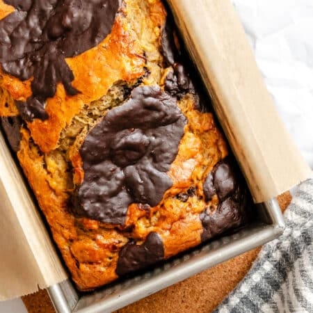 A loaf of marbled banana bread in a pan.