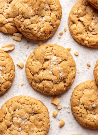 Oatmeal peanut butter cookies on a piece of white parchment paper.