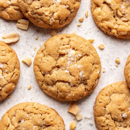 Oatmeal peanut butter cookies on a piece of white parchment paper.