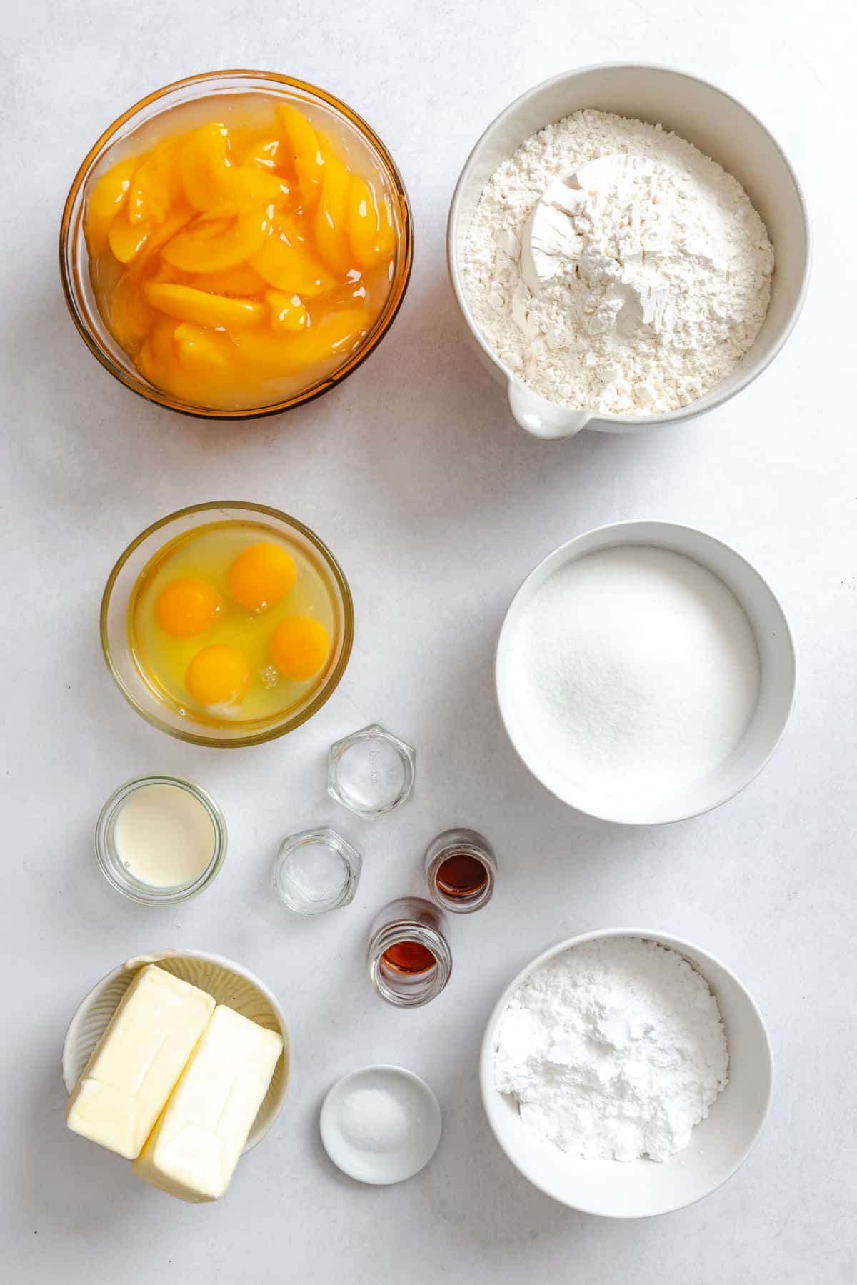 Ingredients for peach pie bars in dishes.