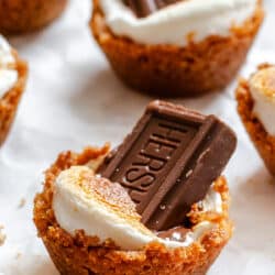 S'mores cups on a piece of white parchment paper.