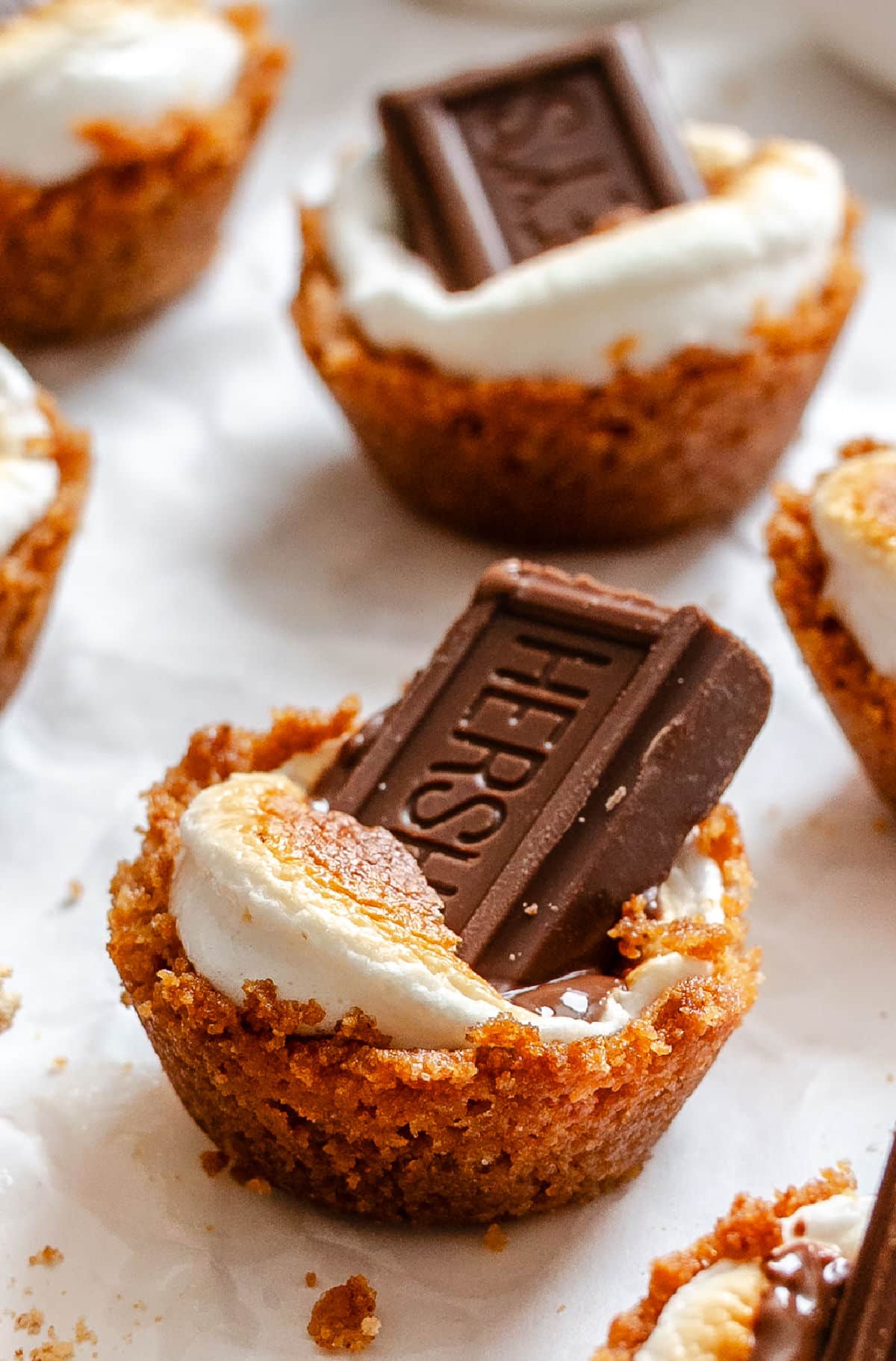 S'mores cups on a piece of white parchment paper.